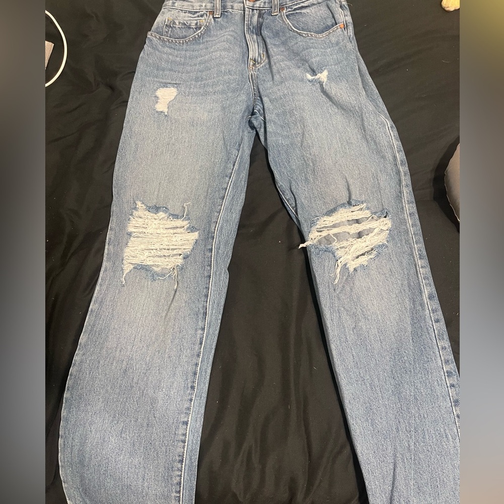 Light blue ripped jeans